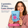 A smiling woman holds a light blue bag of Calvro Mood Snacks gummies against a light beige background with promotional text. The package is light blue with a pink cartoon gummy and the words 'Mood snacks' and 'Saffron Gummies'.